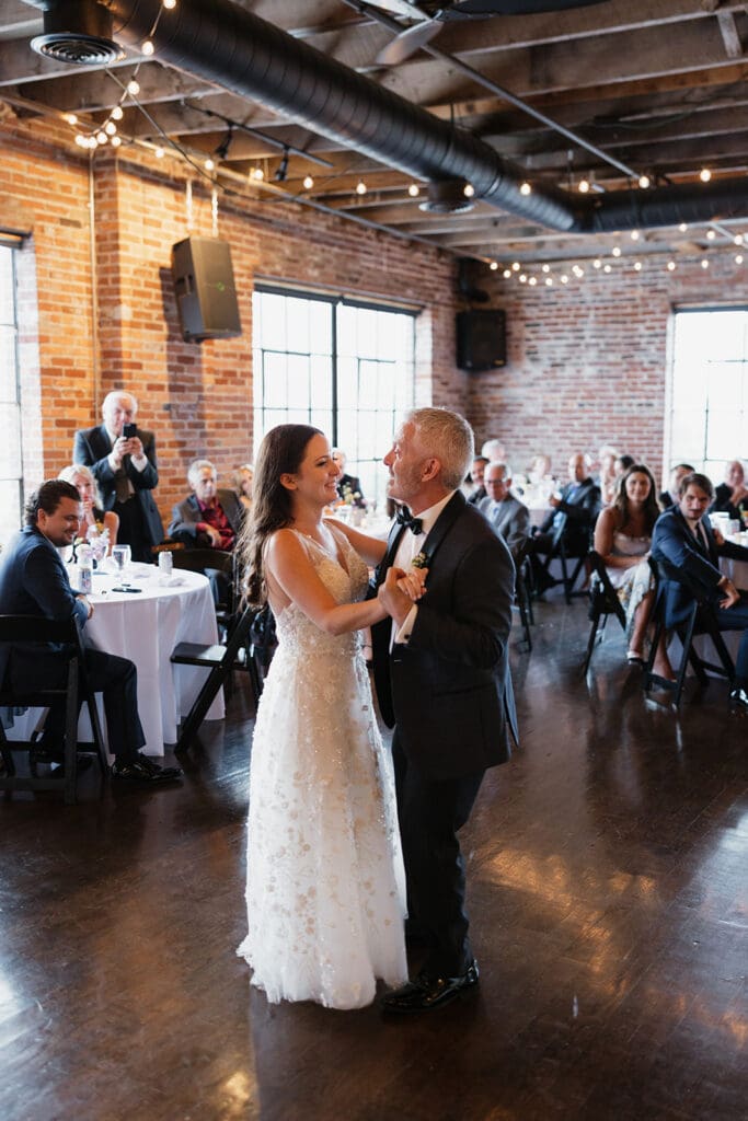 People dancing at wedding reception at historic wedding venue Room With A View.