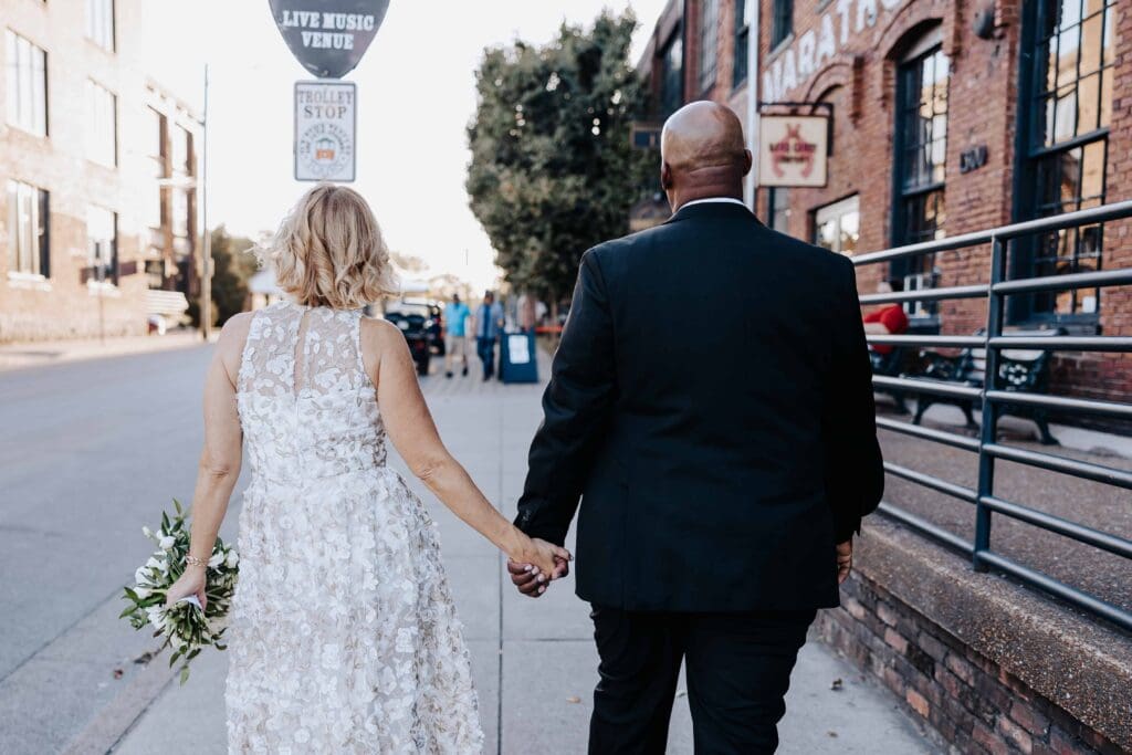 Couple walking outside at Nashville wedding venue Room With A View.