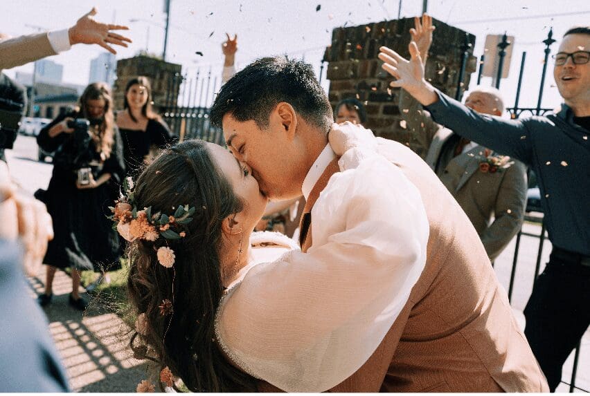 Newlywed couple kissing and celebrating at Room With A View in Nashville.