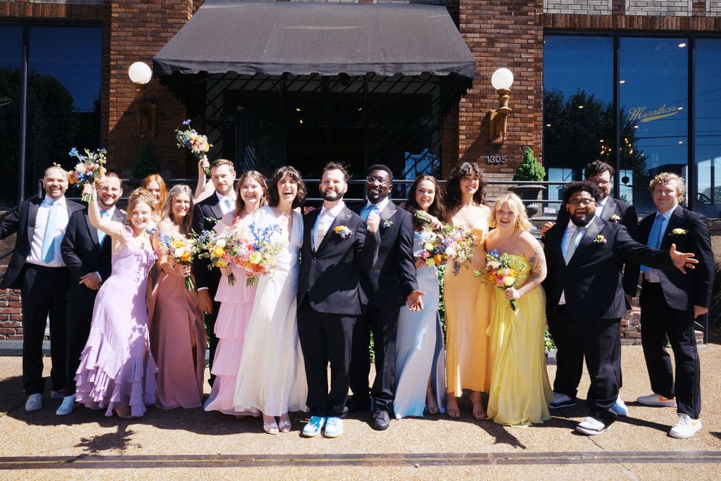 Bridal party standing outside of historic wedding venue in Nashville, Room With A View.