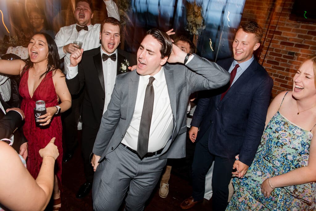 Man dancing at wedding venue Room With A View. 