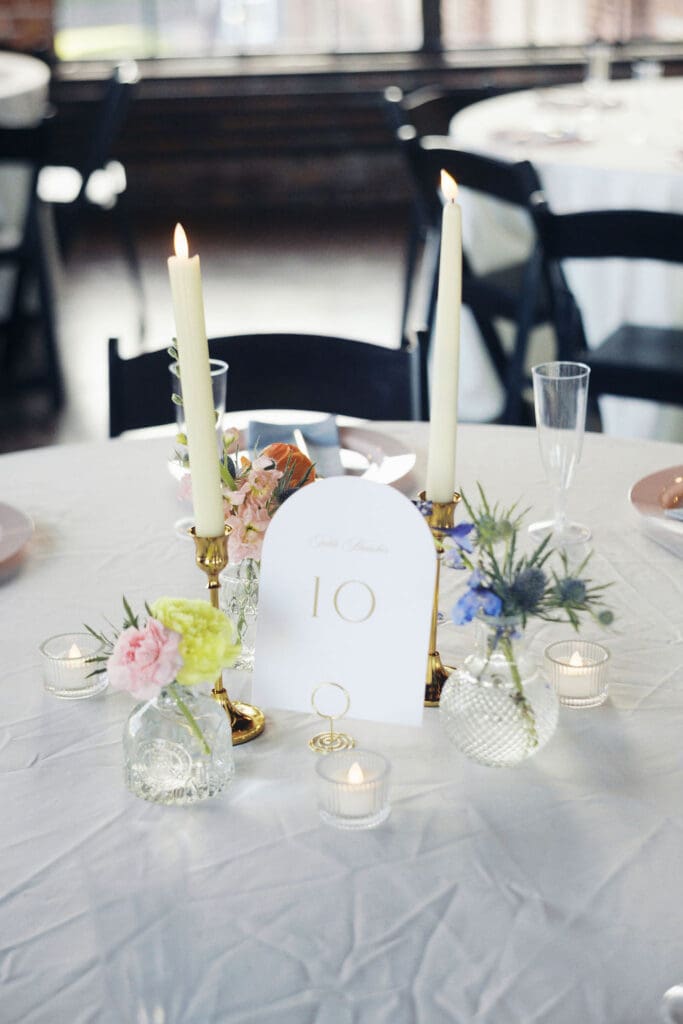 Table decor and table number at historic, romantic wedding venue Room With A View.