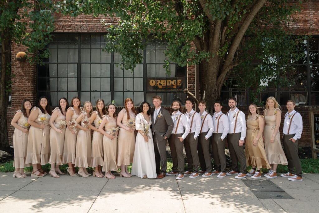 Bridal party standing outside of historic wedding venue in Nashville, Room With A View.